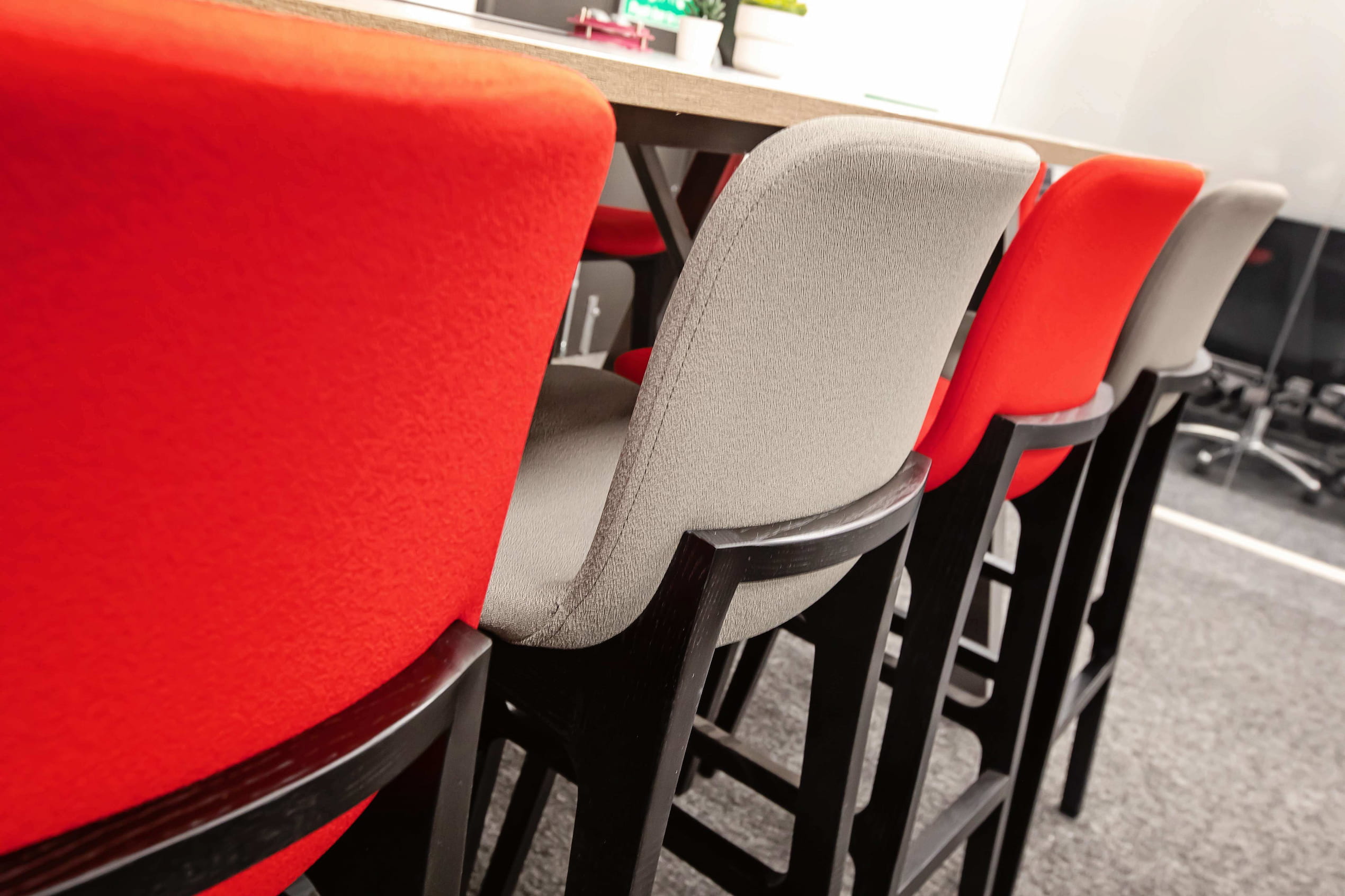 The back of red and grey alternating stools.